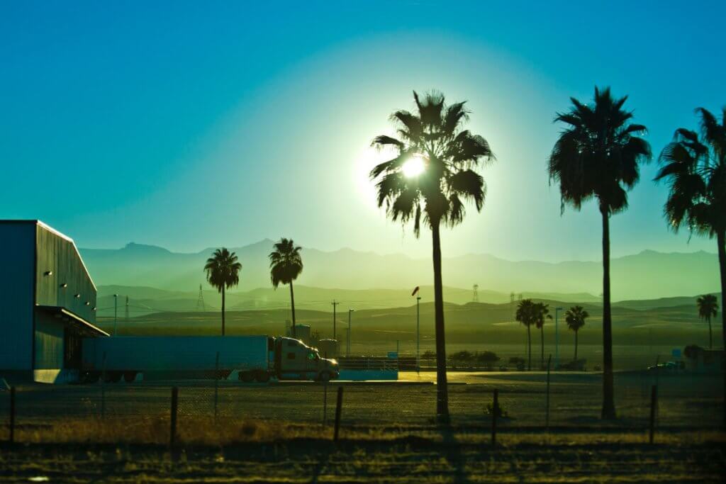 Commercial truck at California loading dock operating under California Motor Carrier Permit requirements
