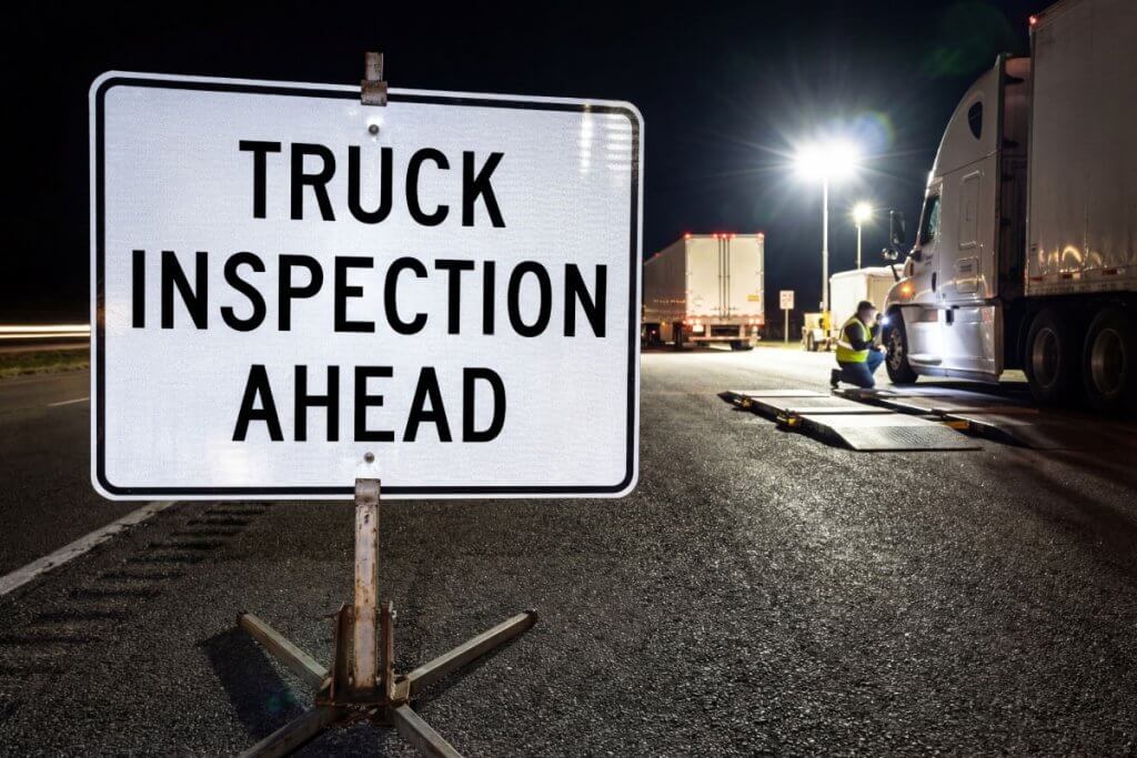 Roadside inspection revealing fleet maintenance violation on commercial truck